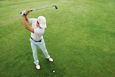 Golfer mid-swing