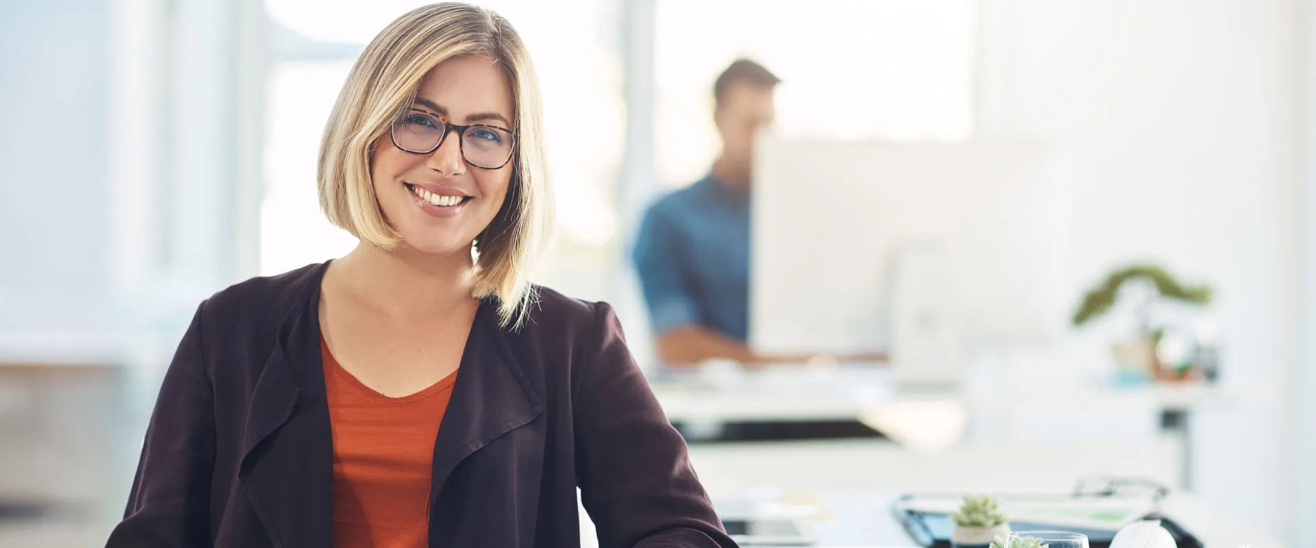 A smiling patient in a bright office